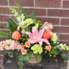 Arriving in a beautiful, peachy keepsake ceramic, in tones of peach, pink