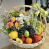 Flowers and assorted fruits of the season! In a beautiful small basket