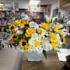 Modern floral arrangement in base! Orange, yellow, and white colors! Elegant and