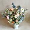 This garden-style floral arrangement captures the charm of a countryside bloom with