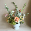 This garden-style floral arrangement captures the charm of a countryside bloom with