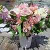 Stock, hydrangea, roses, alstromeria, daisy poms, carnations, spray roses, lavender monte and