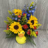 Fresh cut flowers arranged in a keepsake ceramic rubber duck container. Flowers