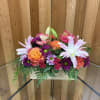 This cheerful and vibrant design features a gorgeous blend of pink lilies