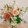 Honey Silk is a soft and sophisticated flower arrangement featuring a timeless