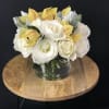 Nested in a bunches of gorgeous white roses are a some lovely