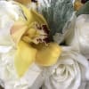 Nested in a bunches of gorgeous white roses are a some lovely
