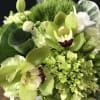 mini green hydrangeas, white freesia, green cymbidium orchid, green carnation ,ornamental cabbage