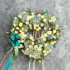 This beautiful arrangement comes in a stunning mix of blue hydraenids, white