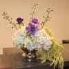 Add timeless elegance to your space with our Elegant Symphony Floral Arrangement.