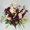 This lovely floral gift offers fresh flowers in a charming ceramic teacup