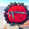 100 fresh red roses elegantly wrapped in black paper. Wow? More than