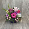 A wonderful assortment of berry colored flowers.