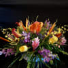 This beautiful blend of orchids, protea and even kale come togther so