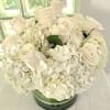 We&#039;ve combined white hydrangea and roses in order to give this arranged