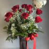 A beautiful classic: one dozen long-stem red roses designed with greens and