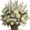 This magnificent bouquet of classic all-white flowers in a graceful vase is