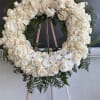 Elegant white roses arranged in a serene and graceful display, symbolizing peace