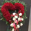 This heart make with red carnations and white roses 