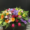 This beautiful casket spray make with lavender hydrangea and stock  