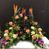 This beautiful arrangement make with roses, orchid, bird of paradise , 
