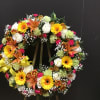 This beautiful wreath made roses, carnations, lilies, daisy  and gebera
