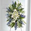 A collection of bold blue flowers shares a tribute that words cannot