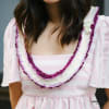 Our Christina lei is truly a sight to behold, featuring purple dendrobium