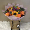 Wrapped bouquet to include sunflowers a mixture of flowers and garden roses.