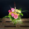 Roses, daisies, carnations and mums, this arrangement is popping with joyful spring