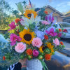 Fresh mix of colorful and fragrant florals, featuring tulips sunflowers lilies carnations