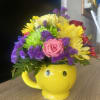 Happy face mug with fresh flowers 