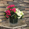 Introducing the Enchanted Bloomsquare, a mesmerizing square clear vase filled with delicate