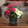Introducing the Enchanted Bloomsquare, a mesmerizing square clear vase filled with delicate