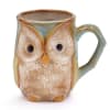 Cream colored embossed owl shape on the front, mint green wings, and