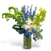 This beautiful blue and green arrangement has hydrangeas, roses, delphiniums, cymbidium orchids