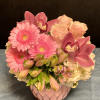 A romantic medley of soft and striking pinks, this lush arrangement speaks