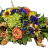 This arrangement was designed with Purple Statice, Orange Roses, Bronze Mums, Green