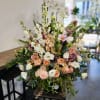 Base on Peach with touch of white and hanging greenery.
For Sympathy, Occasion.