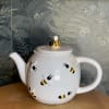 This adorable ceramic teapot and mug set is perfect for a bee
