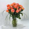 This magnificent arrangement is all orange roses with lily grass in a