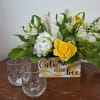 Adorable bee box that comes filled with yellow and white blooms and
