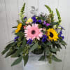 Enjoy the beautiful colors of spring with this foot-tall arrangement designed in