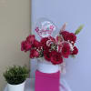 Arrangement of roses and lilies with a personalized bubble balloon.