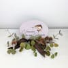 Fishing Memorial stone sitting on easel, with artificial decor and ribbon. 

&quot;Forever