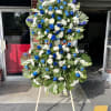 Show support for your loved ones with this deep blue standing spray.
The