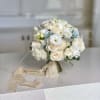 A stunning wedding bouquet for the bride or bridesmaids. Arrangement in ivory