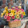 This summer arrangement feels like sunlight captured in flowers. The gerberas radiate