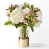 Capturing the essence of a cool spring day, this delicate arrangement is