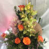 Fan with Full stems of cymbidium orchid from New Zealand mix with